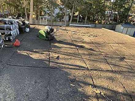 Machine-assisted flat roof tear-off Toronto