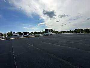 Commercial roof seam leak repair around unit — Toronto