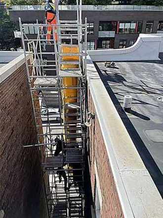 Mid-rise commercial flat roof repair Toronto
